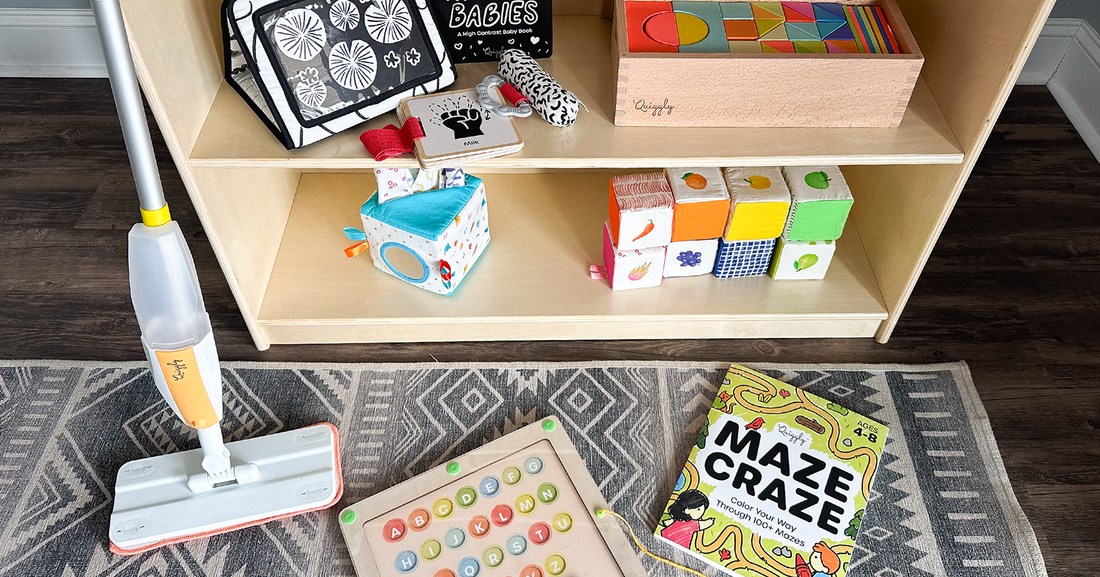 Quiggly's Montessori toys in a play area - including the kid spray mop, the black & white set, the colorful wooden blocks, the fabric tissue box toy, the soft blocks set, magnetic maze & maze craze book
