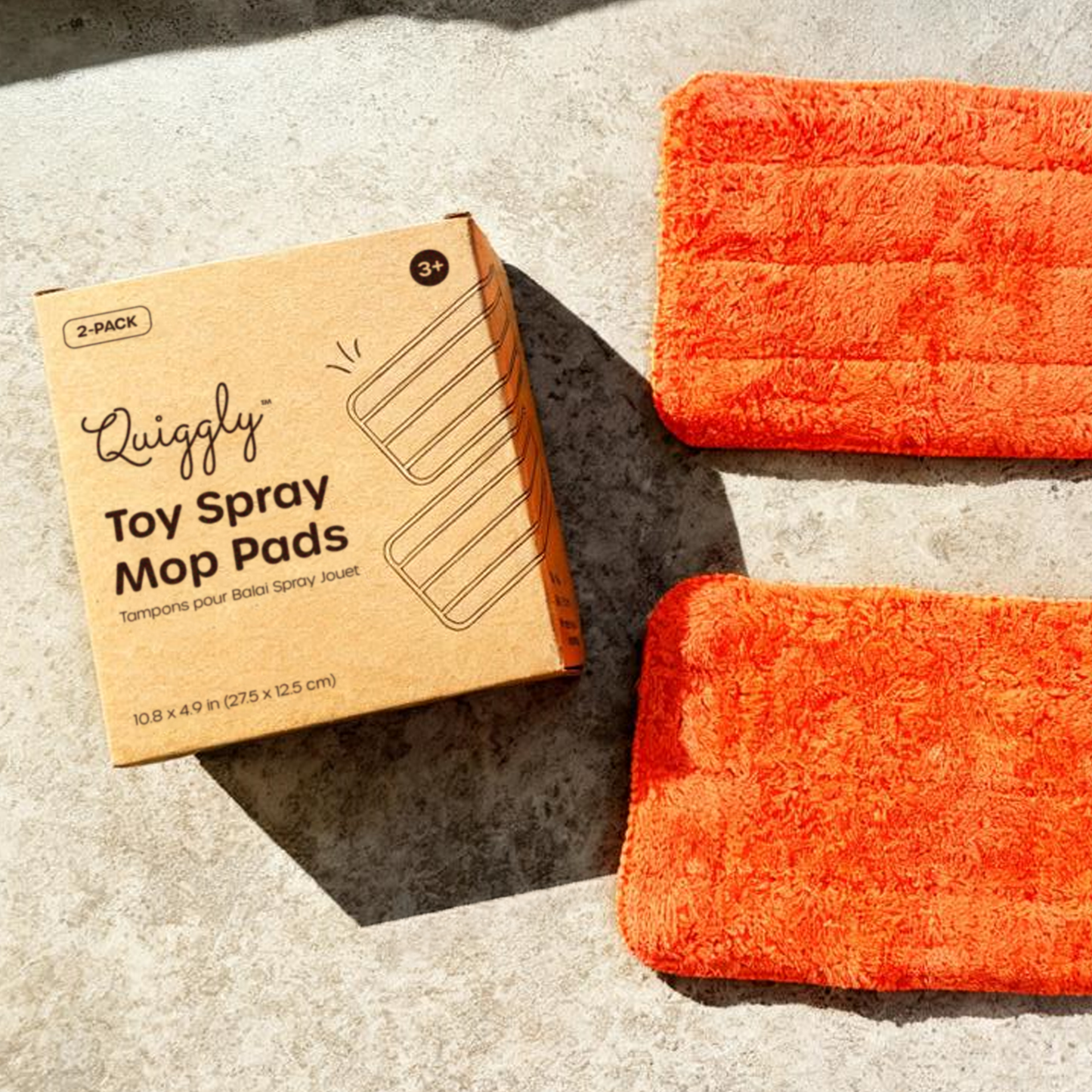 Quiggly Toy Spray Mop Pads packaging with two reusable mop pads for endless cleaning fun