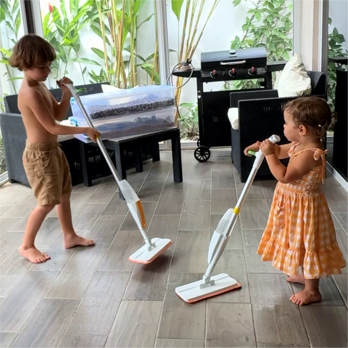 Quiggly toddler and big kids real spray mops in action with 3 year old and 7 year old children cleaning at home