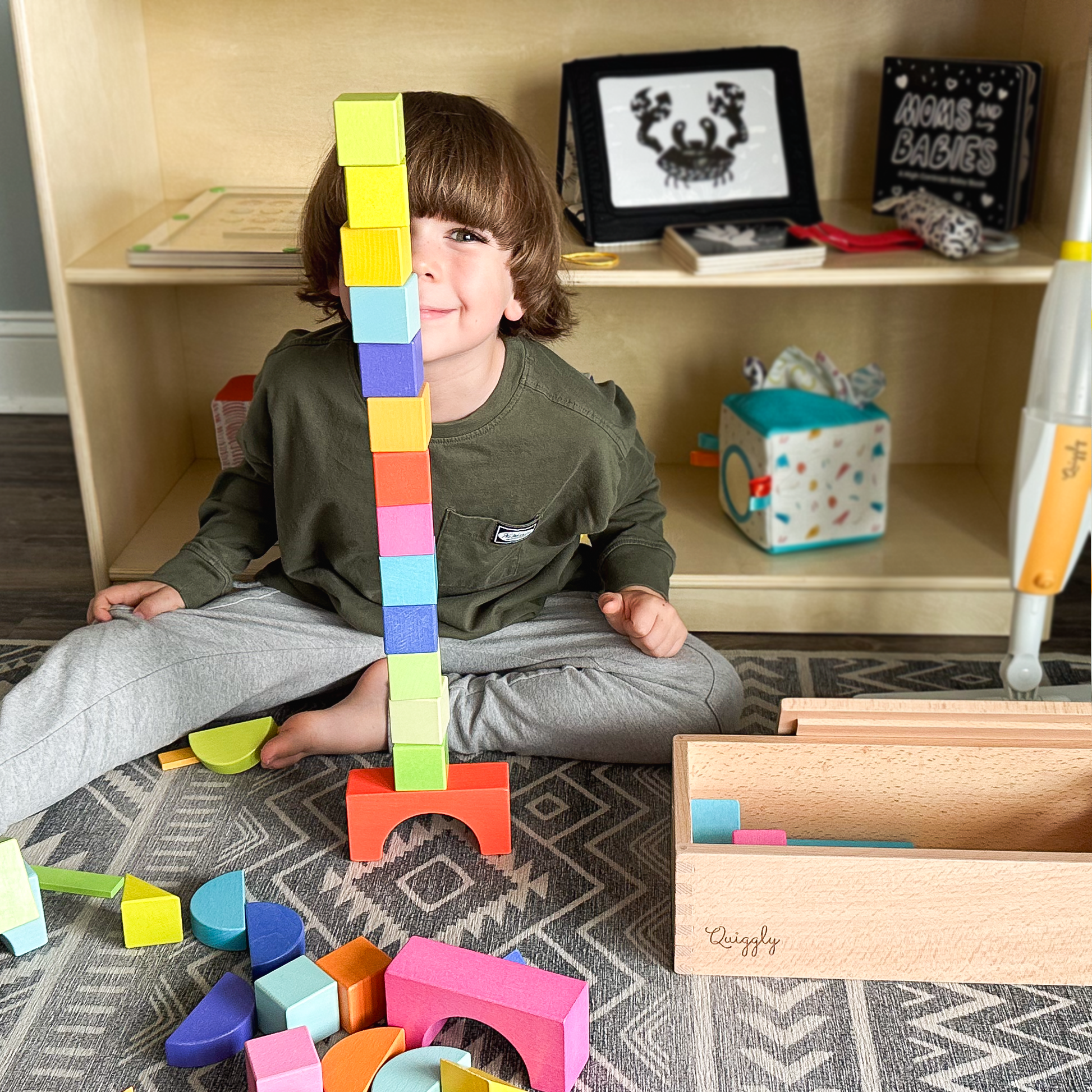 Kids stacking wooden blocks into tall towers during hands-on playtime
