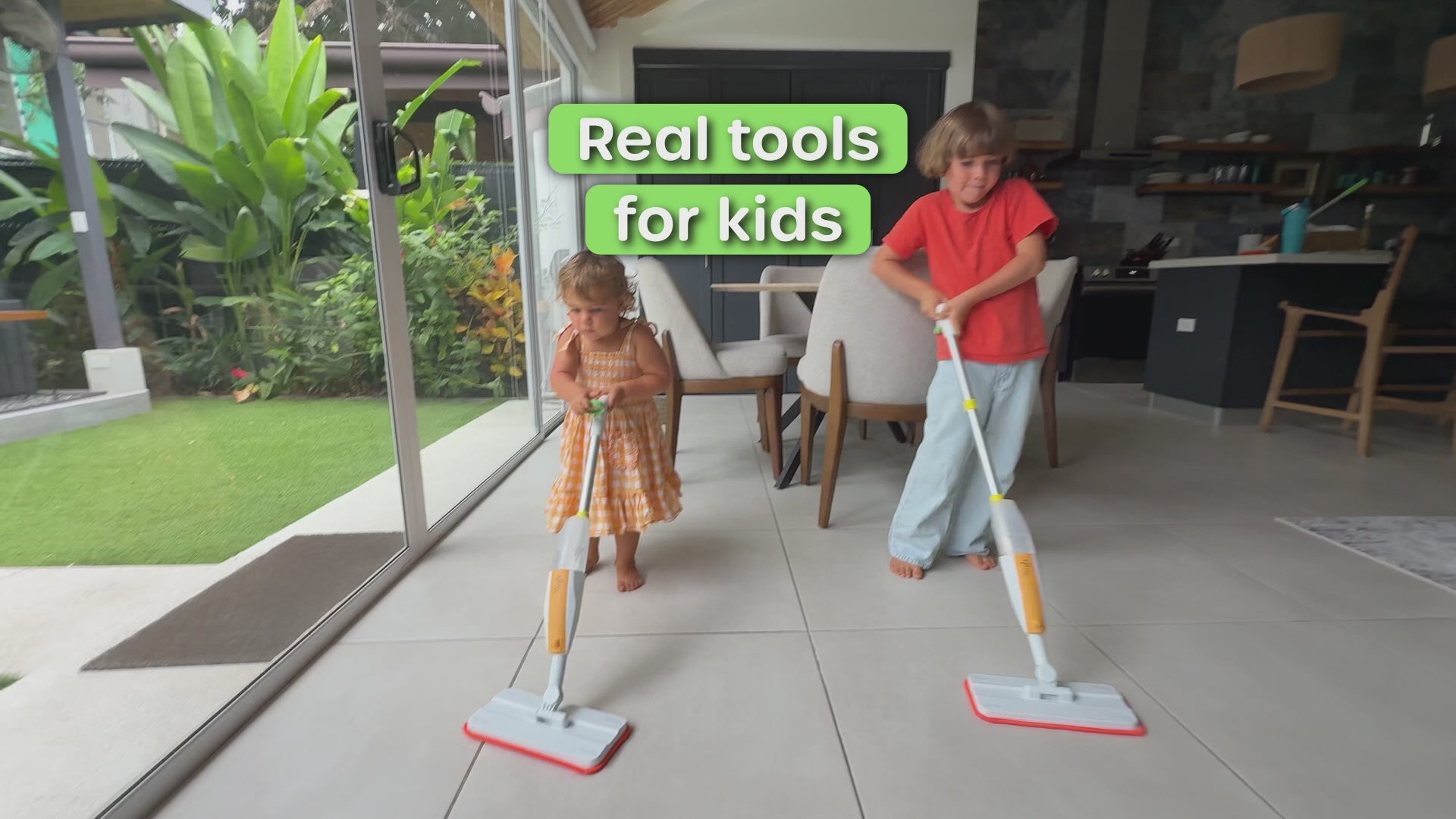 Quiggly toddler vs big kids spray mop comparison video showing age-appropriate handle designs for motor skill development, height-matched sizing, spray function, and easy to clean and fill features